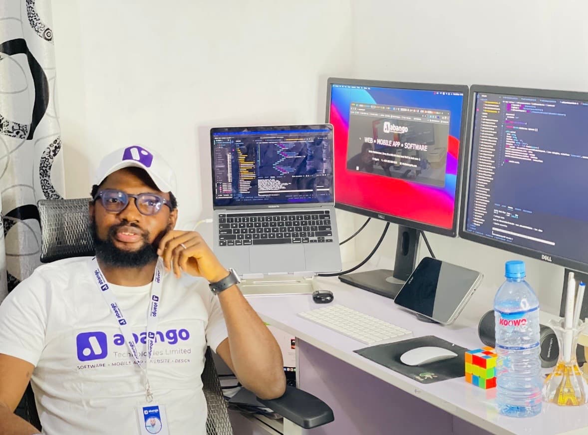 Abiodun, founder and CEO of Abango Technologies, at his desk