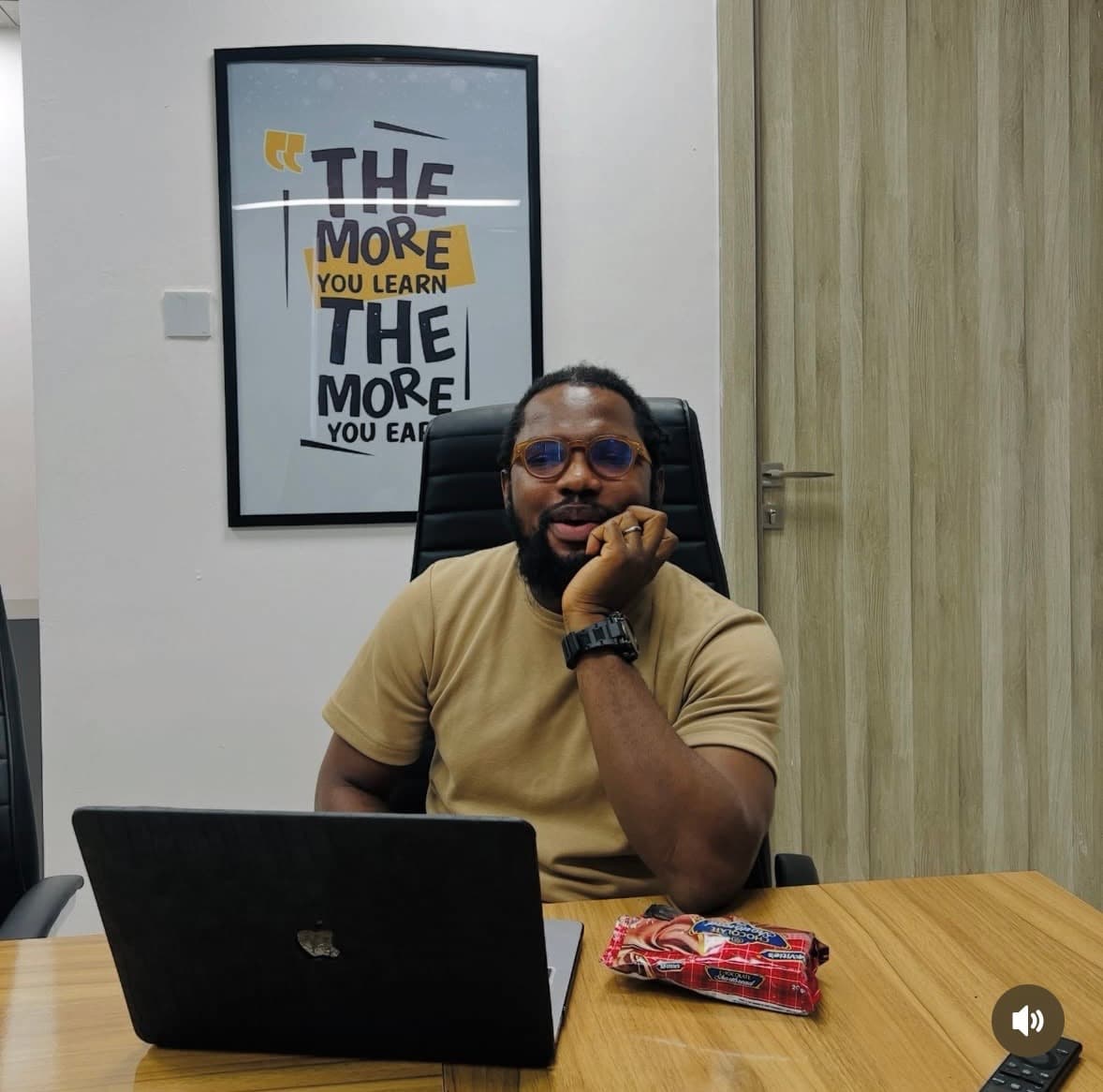 Abiodun reviewing a new project brief at his desk
